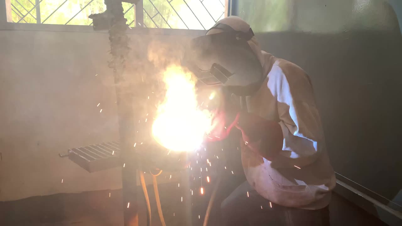 Welder at work in a fabrication workshop
